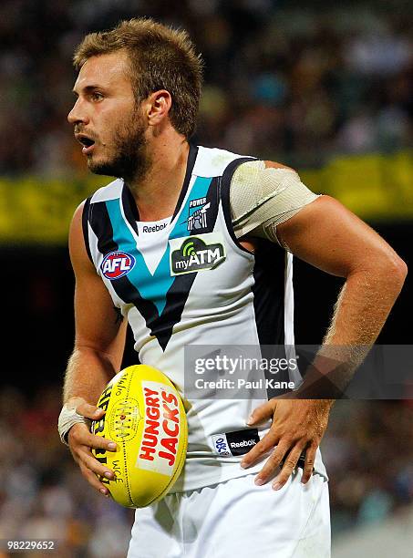 Tom Logan of the Power looks for a pass option during the round two AFL match between the West Coast Eagles and Port Adelaide Power at Subiaco Oval...