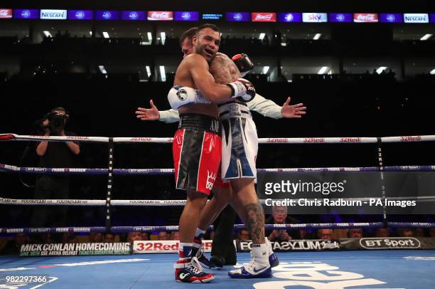 Martin Murray and Roberto Garcia embrace after Murray is declared victor by points in the The WBC Silver Middleweight Championship at The O2, London.
