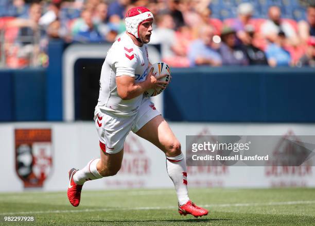 Chris Hill of England runs the ball back during the second half of a Rugby League Test Match between England and the New Zealand Kiwis at Sports...