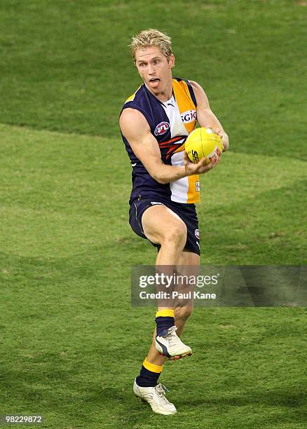 Adam Selwood of the Eagles handballs during the round two AFL match between the West Coast Eagles and Port Adelaide Power at Subiaco Oval on April 3,...