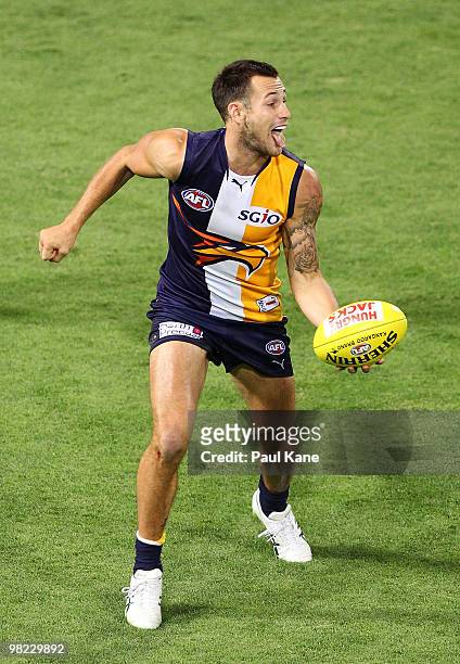 Chris Masten of the Eagles handballs during the round two AFL match between the West Coast Eagles and Port Adelaide Power at Subiaco Oval on April 3,...