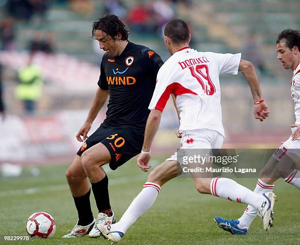 Leonardo Bonucci of AS Bari battles for the ball with Luca Toni of AS Roma during the Serie A match between AS Bari and AS Roma at Stadio San Nicola...