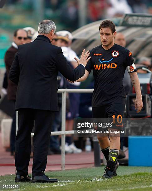 Francesco Totti of AS Roma shakes hands with coach Claudio Ranieri during the Serie A match between AS Bari and AS Roma at Stadio San Nicola on April...