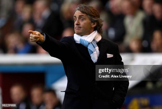 Manchester City Manager Roberto Mancini issues instructions during the Barclays Premier League match between Burnley and Manchester City at Turf Moor...