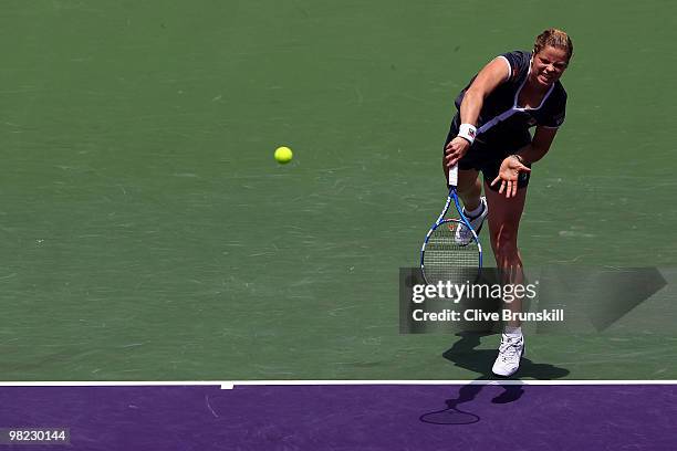 Kim Clijsters of Belgium serves against Venus Williams of the United States during the women's final of the 2010 Sony Ericsson Open at Crandon Park...