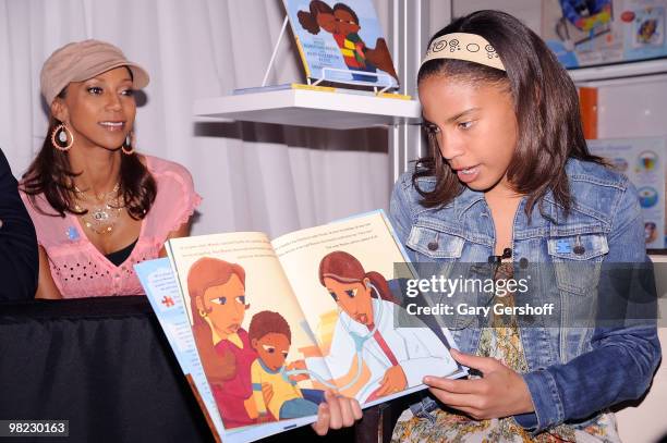 Actress and author Holly Robinson Peete and daughter Ryan Elizabeth Peete promote "My Brother Charlie" and "Not My Boy!" at Toys "R" Us on April 3,...