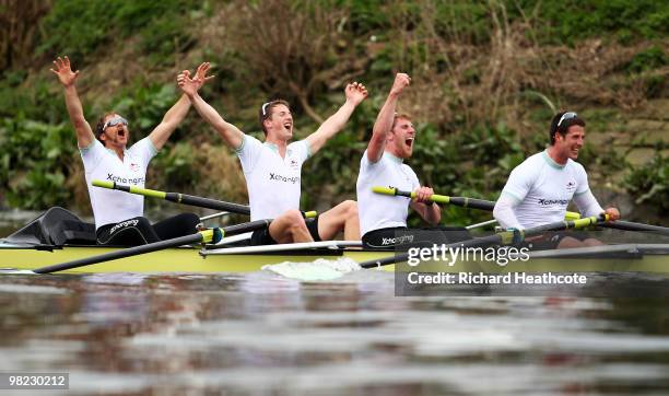 Rob Weitemeyer, Geoff Roth, George Nash and Peter McClelland of Cambridge celebrate victory during the 156th Oxford and Cambridge University Boat...