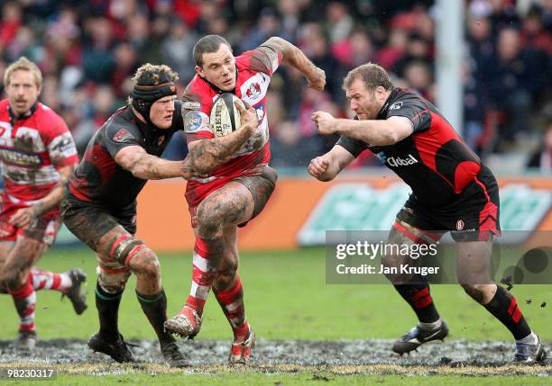 Tim Molenaar of Gloucester evades the tackle of Hugh Vyvyan of Saracens during the Guinness Premiership match between Gloucester and Saracens at...