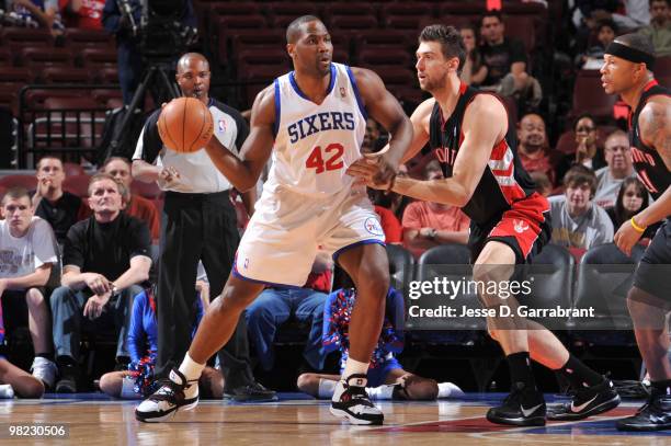 Elton Brand of the Philadelphia 76ers looks to pass against Andrea Bargnani of the Toronto Raptors during the game on April 3, 2010 at the Wachovia...