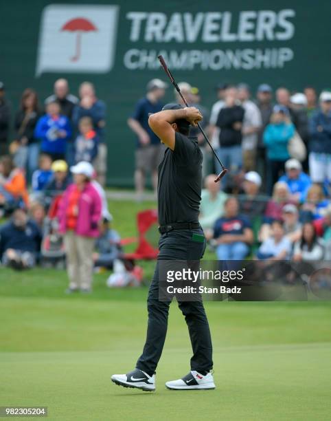 Jason Day of Australia reacts to his putt on the 17th hole during the third round of the Travelers Championship at TPC River Highlands on June 23,...