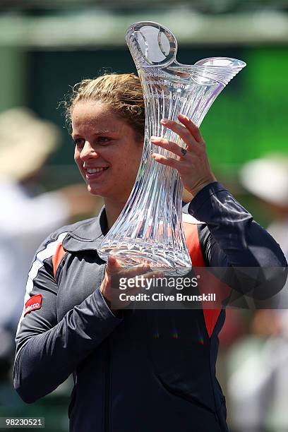 Kim Clijsters of Belgium holds up the trophy after defeating Venus Williams of the United States in straight sets to win the women's final of the...
