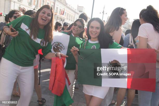 Mexican football fans seen holding the flag of Mexico while celebrating the victory against South Korea in the World Cup. The Mexican national...