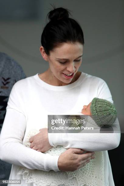 New Zealand Prime Minister Jacinda Ardern poses for a photo with her new baby girl Neve Te Aroha Ardern Gayford on June 24, 2018 in Auckland, New...