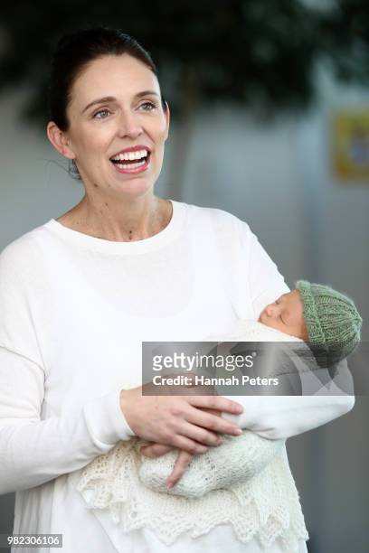 New Zealand Prime Minister Jacinda Ardern poses for a photo with her new baby girl Neve Te Aroha Ardern Gayford on June 24, 2018 in Auckland, New...