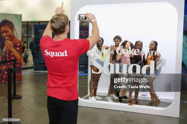 Guests pose for a photo at the Coca-Cola Music Studio during the 2018 BET Experience at the Los Angeles Convention Center on June 23, 2018 in Los...