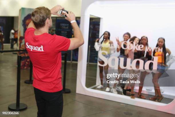 Guests pose for a photo at the Coca-Cola Music Studio during the 2018 BET Experience at the Los Angeles Convention Center on June 23, 2018 in Los...