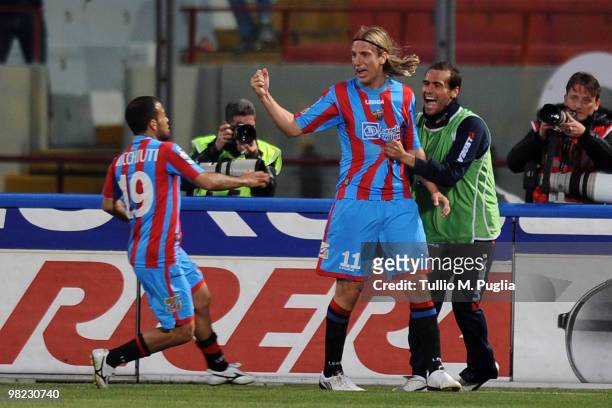 Maxi Lopez of Catania celebrates with Adrian Ricchiuti after scoring his second goal during the Serie A match between Catania Calcio and US Citta di...