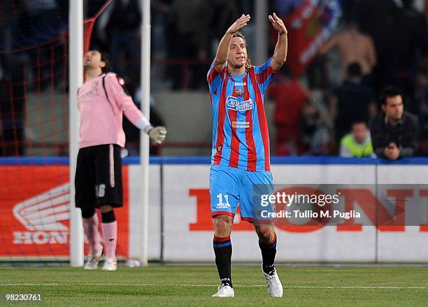 Maxi Lopez of Catania celebrates after scoring his second goal as goalkeeper Salvatore Sirigu of Palermo reacts during the Serie A match between...