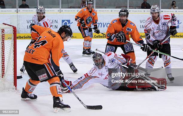 Norm Milley of Wolfsburg tries to score against goalkeeper Jean-Sebastien Aubin of DEG Metro Stars during the third DEL quarter final play-off game...