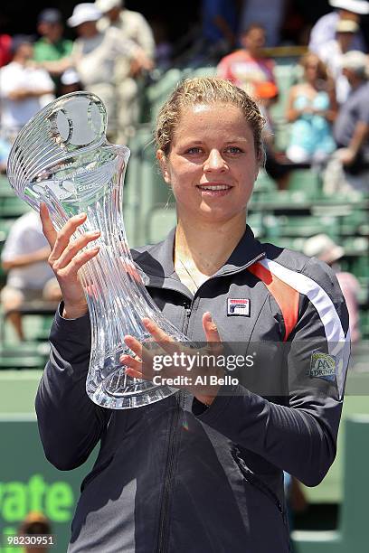 Kim Clijsters of Belgium holds the trophy after defeating Venus Williams of the United States in straight sets to win the women's final of the 2010...