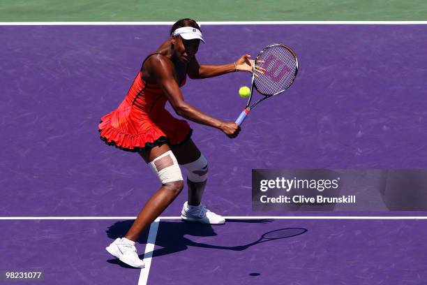 Venus Williams of the United States returns a shot against Kim Clijsters of Belgium during the women's final of the 2010 Sony Ericsson Open at...