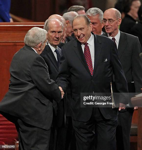 President of the Church of Jesus Christ of Latter-Day Saints Thomas Monson shakes the hand of Boyd Packer , President of the Mormon Quorum of the...