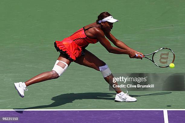 Venus Williams of the United States returns a shot against Kim Clijsters of Belgium during the women's final of the 2010 Sony Ericsson Open at...