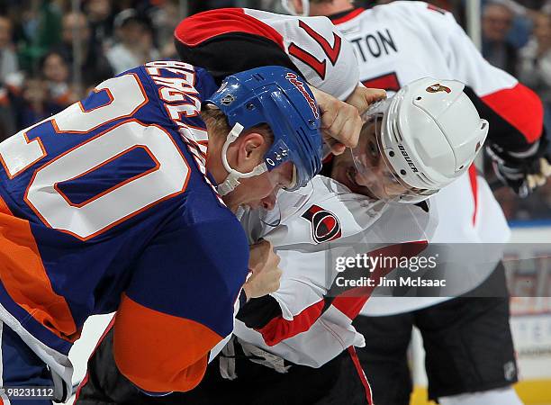 Nick Foligno of the Ottawa Senators trades punches with Sean Bergenheim of the New York Islanders during their first period fight on April 3, 2010 at...