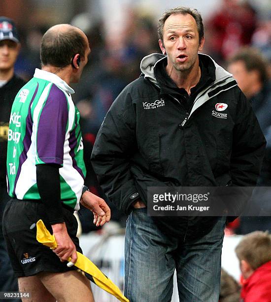 Brendan Venter Saracens Coach speaks with the linesman at half time during the Guinness Premiership match between Gloucester and Saracens at...