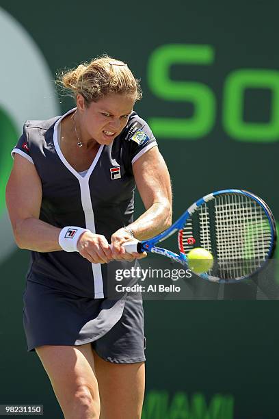 Kim Clijsters of Belgium returns a shot against Venus Williams of the United States during the women's final of the 2010 Sony Ericsson Open at...