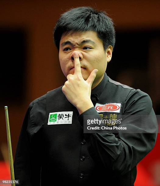 Ding Junhui of China looks on during his semifinal match against Mark Allen of Northern Ireland during the 6th day of the 2010 World Snooker China...
