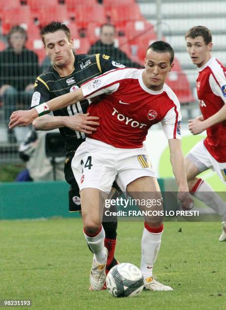Valenciennes' Foued Kadir vies with Lille's Mathieu Debuchy during their French L1 football match Valenciennes vs. Lille on April 3, 2010 at the...