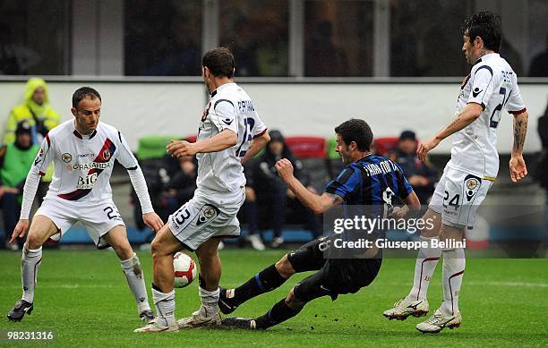 Thiago Motta of Inter competes for the ball with Salvatore Lanna , Daniele Portanova and Antonio Busce during the Serie A match between FC...