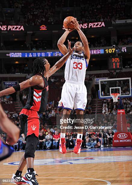Willie Green of the Philadelphia 76ers shoots against Chris Bosh of the Toronto Raptors during the game on April 3, 2010 at the Wachovia Center in...