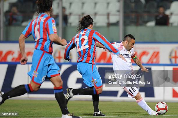 Fabrizio Miccoli of Palermo and Pablo Alvarez of Catania compete for the ball during the Serie A match between Catania Calcio and US Citta di Palermo...