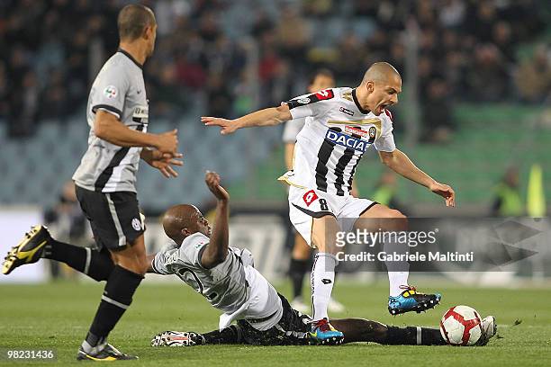 Gokhan Inler of Udinese Calcio is tackled by Mohamed Lamine Sissoko of Juventus FC during the Serie A match between Udinese Calcio and Juventus FC at...