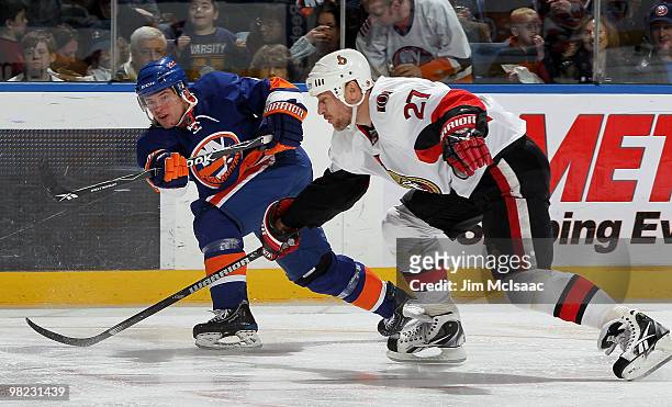 Dylan Reese of the New York Islanders fires the puck past Alex Kovalev of the Ottawa Senators for a second period goal on April 3, 2010 at Nassau...