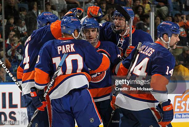 Jack Hillen of the New York Islanders celebrates his second period goal against the Ottawa Senators with his teammates on April 3, 2010 at Nassau...