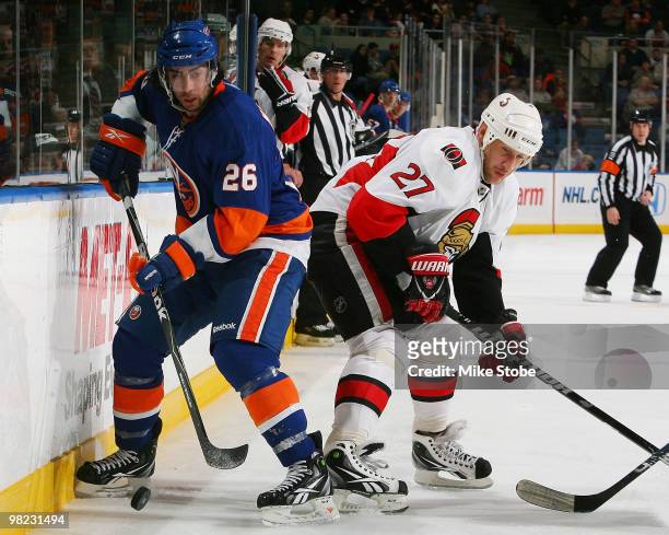 Alexi Kovalev of the Ottawa Senators backs into Matt Moulson of the New York Islanders on April 3, 2010 at Nassau Coliseum in Uniondale, New York.