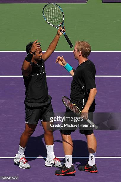 Lukas Dlouhy of the Czech Republic and Leander Paes of India celebrate after defeating Mahesh Bhupathi of India and Max Mirnyi of Belarus to win the...