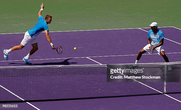 Mahesh Bhupathi of India and Max Mirnyi of Belarus play against Lukas Dlouhy of the Czech Republic and Leander Paes of India during the men's doubles...