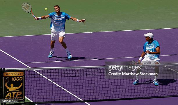Mahesh Bhupathi of India and Max Mirnyi of Belarus play against Lukas Dlouhy of the Czech Republic and Leander Paes of India during the men's doubles...