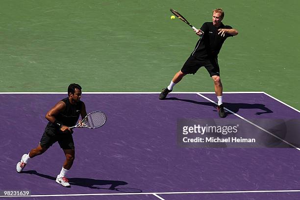 Lukas Dlouhy of the Czech Republic and Leander Paes of India play against Mahesh Bhupathi of India and Max Mirnyi of Belarus during the men's doubles...