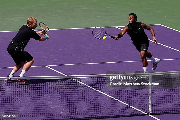 Lukas Dlouhy of the Czech Republic and Leander Paes of India celebrate play against Mahesh Bhupathi of India and Max Mirnyi of Belarus during the...