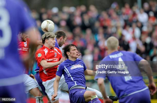 Carsten Kammlott of Erfurt and Marc Hensel of Aue fight for the ball during the third Liga match between Rot Weiss Erfurt and Erzgebirge Aue at the...