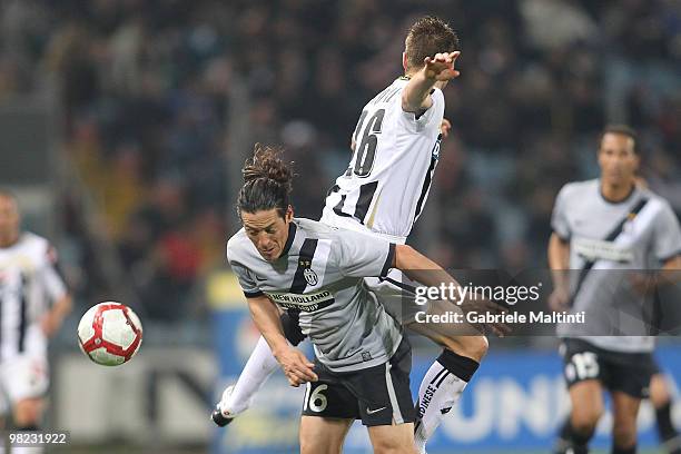 Giovanni Pasquale of Udinese Calcio battles for the ball with Mauro German Camoranesi of Juventus FC during the Serie A match between Udinese Calcio...