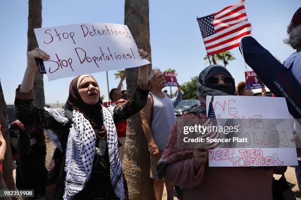 Protesters against the Trump administration's border policies attend a rally at the U.S. Customs and Border Protection Detention Center on June 23,...