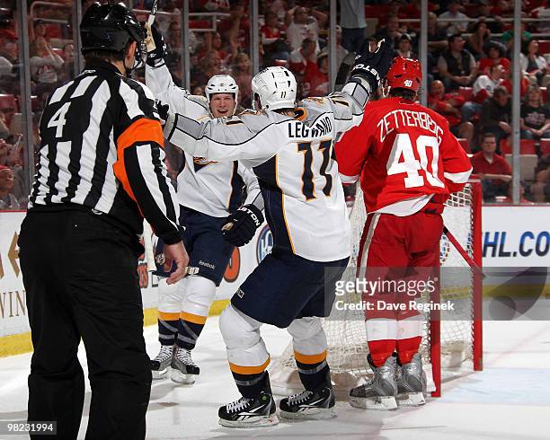 Ryan Suter of the Nashville Predators scores the game-winning goal and is congratulated by teammate David Legwand as Henrik Zetterberg of the Detroit...
