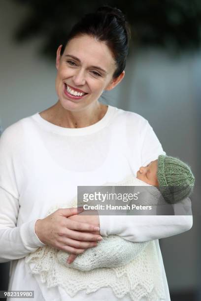 New Zealand Prime Minister Jacinda Ardern poses for a photo with her new baby girl Neve Te Aroha Ardern Gayford on June 24, 2018 in Auckland, New...