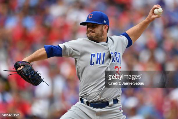 Brian Duensing of the Chicago Cubs pitches in the fourth inning against the Cincinnati Reds at Great American Ball Park on June 23, 2018 in...